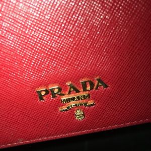 A Prada purse brand new but uses a few times